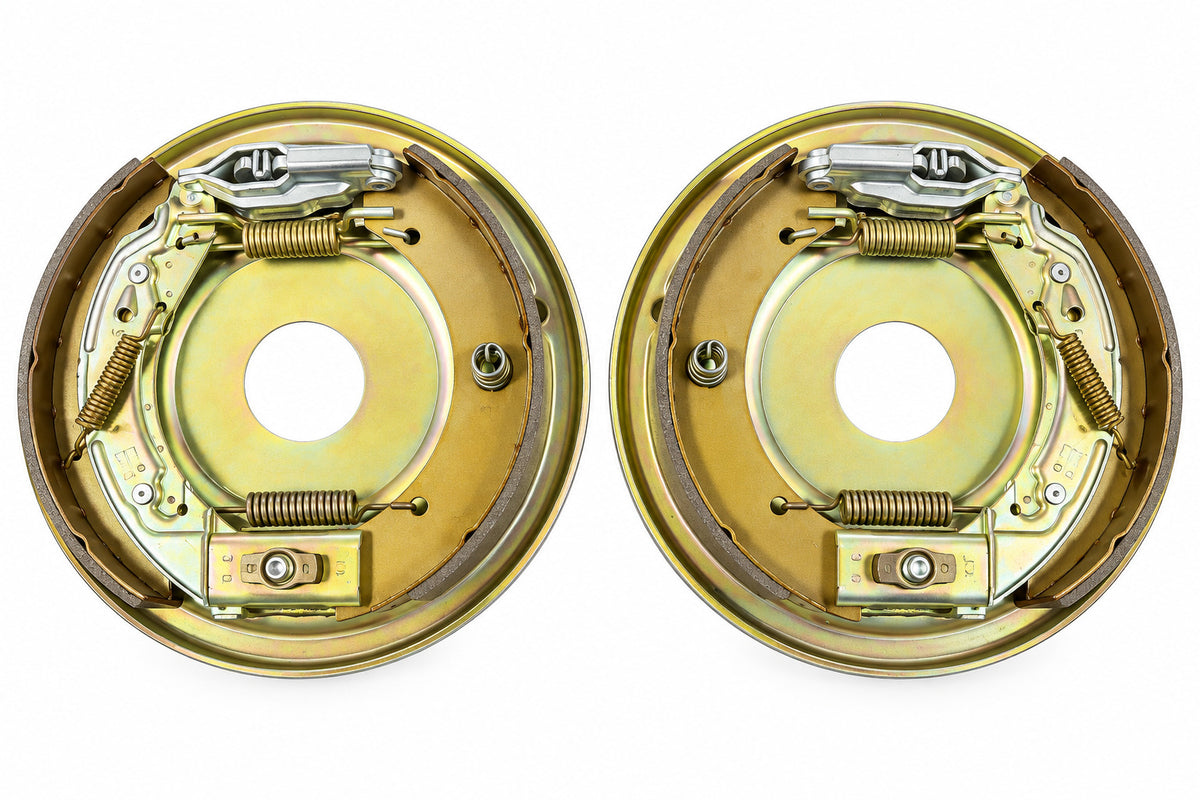 Two metal drum brake assemblies photographed side by side 